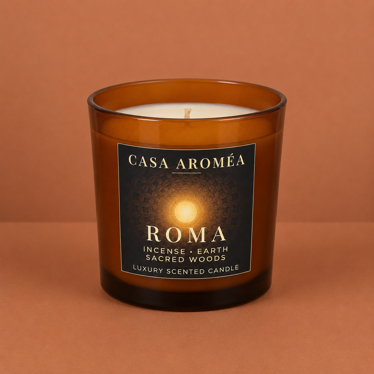 Large Roma scented candle by Casa Aroméa in an amber glass vessel against a warm terracotta and cocoa-toned textured background
